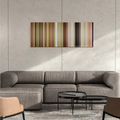 Grown Ups color palette canvas on a concrete wall above a gray sectional sofa