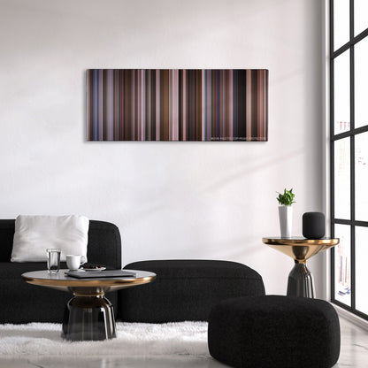 An Education color palette canvas above a black sofa with a gold-topped table