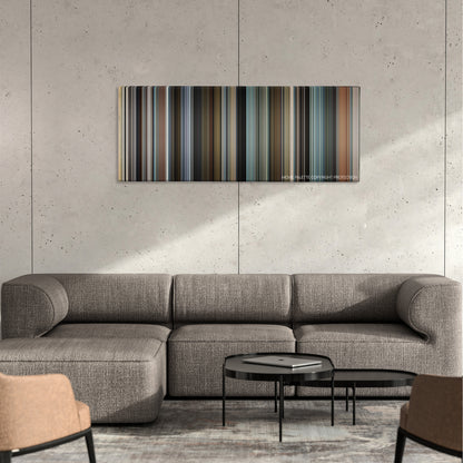 The Interpreter color palette canvas on a concrete wall above a gray sectional sofa