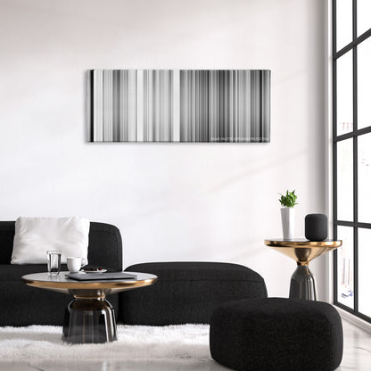 Wild Strawberries color palette canvas above a black sofa with a gold-topped table