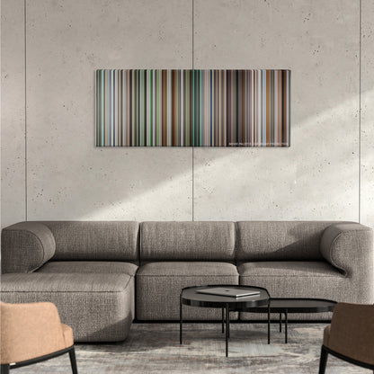 21 Grams color palette canvas on a concrete wall above a gray sectional sofa