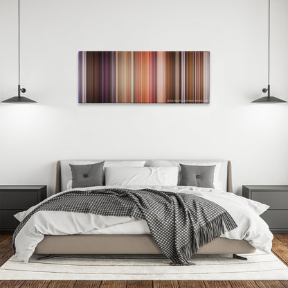 Bedazzled color palette canvas above a bed, between two black pendant lamps