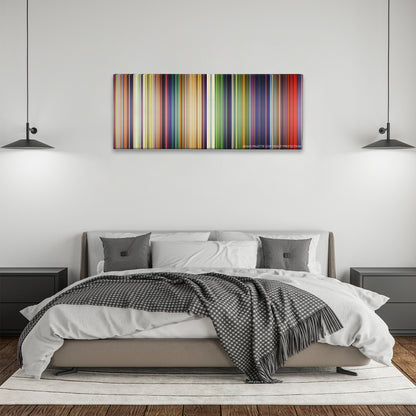 The Lion King color palette canvas above a bed, between two black pendant lamps
