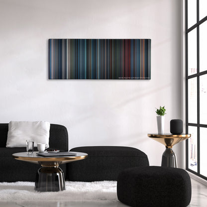 Aliens color palette canvas above a black sofa with a gold-topped table