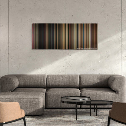 BlacKkKlansman color palette canvas on a concrete wall above a gray sectional sofa