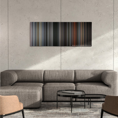 First Blood color palette canvas on a concrete wall above a gray sectional sofa