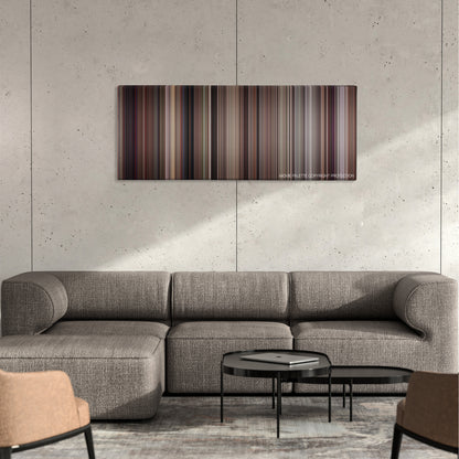 The Man with the Golden Gun color palette canvas on a concrete wall above a gray sectional sofa