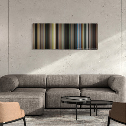 St. Vincent color palette canvas on a concrete wall above a gray sectional sofa