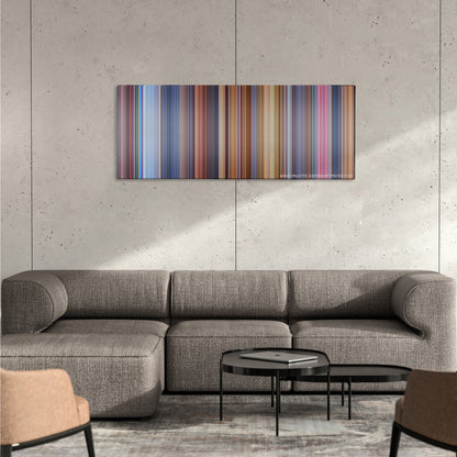 Austin Powers: International Man of Mystery color palette canvas on a concrete wall above a gray sectional sofa
