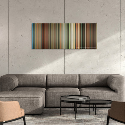 Never Back Down color palette canvas on a concrete wall above a gray sectional sofa