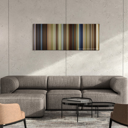 Leap Year color palette canvas on a concrete wall above a gray sectional sofa