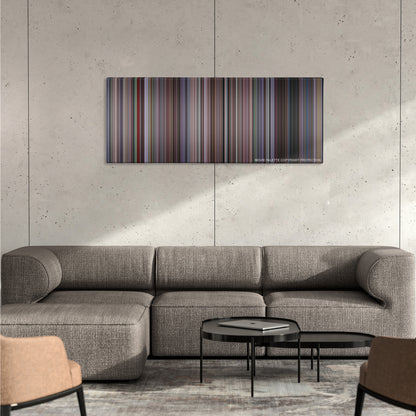 Amores Perros color palette canvas on a concrete wall above a gray sectional sofa