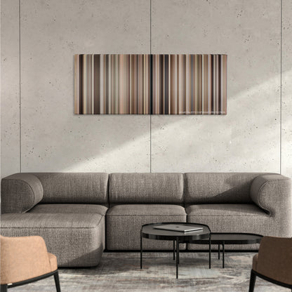 Gandhi color palette canvas on a concrete wall above a gray sectional sofa