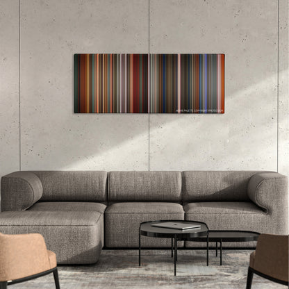 The Last Emperor color palette canvas on a concrete wall above a gray sectional sofa