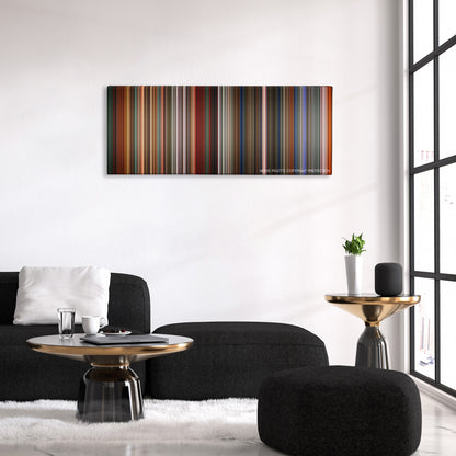 The Last Emperor color palette canvas above a black sofa with a gold-topped table