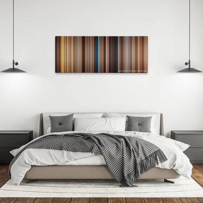 The Five-Year Engagement color palette canvas above a bed, between two black pendant lamps