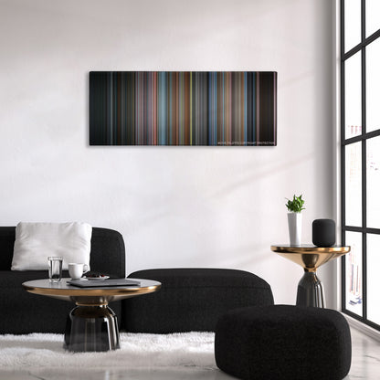Men in Black color palette canvas above a black sofa with a gold-topped table