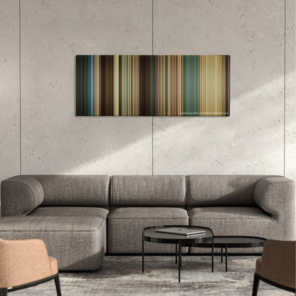 Den of Thieves color palette canvas on a concrete wall above a gray sectional sofa