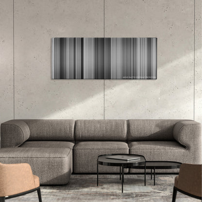 It Happened One Night color palette canvas on a concrete wall above a gray sectional sofa
