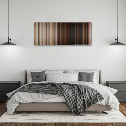 Superbad color palette canvas above a bed, between two black pendant lamps