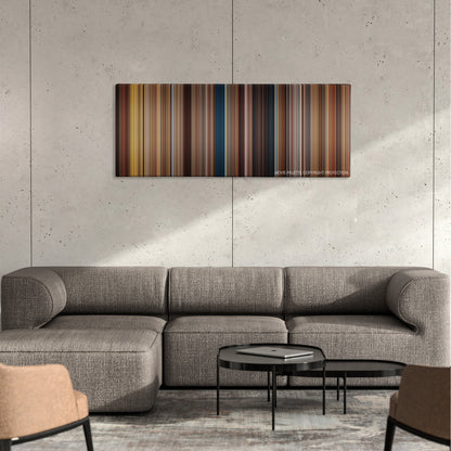 The Five-Year Engagement color palette canvas on a concrete wall above a gray sectional sofa