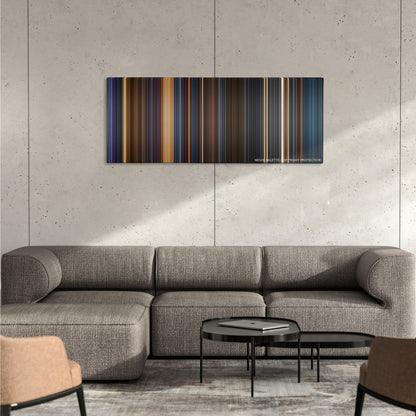 The Chronicles of Riddick color palette canvas on a concrete wall above a gray sectional sofa