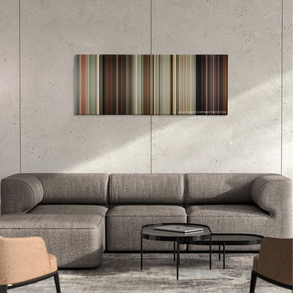 Drive Angry color palette canvas on a concrete wall above a gray sectional sofa