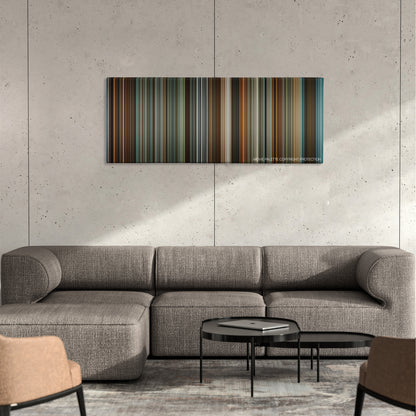 Philomena color palette canvas on a concrete wall above a gray sectional sofa