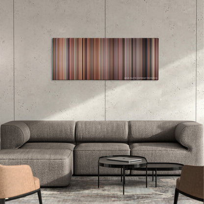Cheaper by the Dozen color palette canvas on a concrete wall above a gray sectional sofa