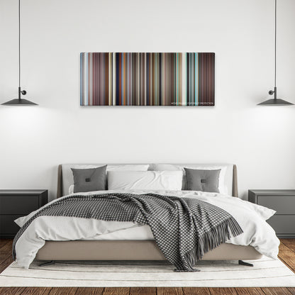 Ali color palette canvas above a bed, between two black pendant lamps