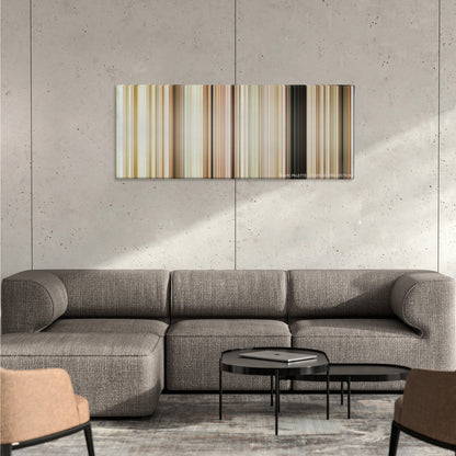 What's Eating Gilbert Grape color palette canvas on a concrete wall above a gray sectional sofa