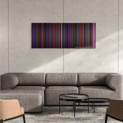 Chicago color palette canvas on a concrete wall above a gray sectional sofa