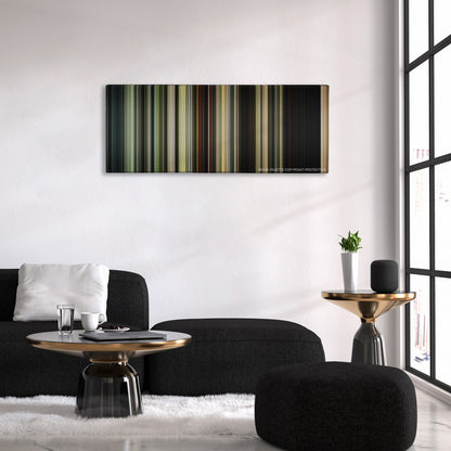 It color palette canvas above a black sofa with a gold-topped table