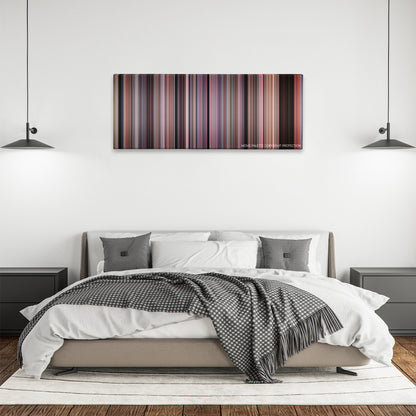Cellular color palette canvas above a bed, between two black pendant lamps