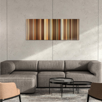 Thank You for Smoking color palette canvas on a concrete wall above a gray sectional sofa