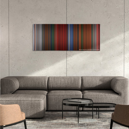 Cube color palette canvas on a concrete wall above a gray sectional sofa
