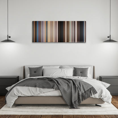 We're the Millers color palette canvas above a bed, between two black pendant lamps