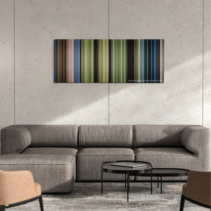 Journey 2: The Mysterious Island color palette canvas on a concrete wall above a gray sectional sofa