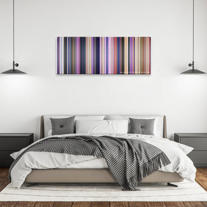 Home color palette canvas above a bed, between two black pendant lamps