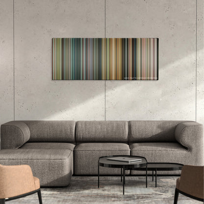 The Brothers Grimsby color palette canvas on a concrete wall above a gray sectional sofa