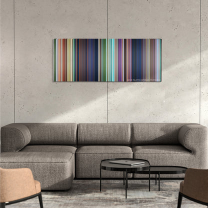 Rio color palette canvas on a concrete wall above a gray sectional sofa