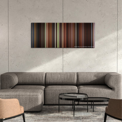 Elizabeth color palette canvas on a concrete wall above a gray sectional sofa