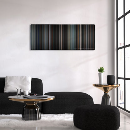 Heat color palette canvas above a black sofa with a gold-topped table