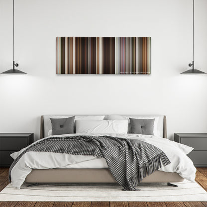 Collateral Beauty color palette canvas above a bed, between two black pendant lamps