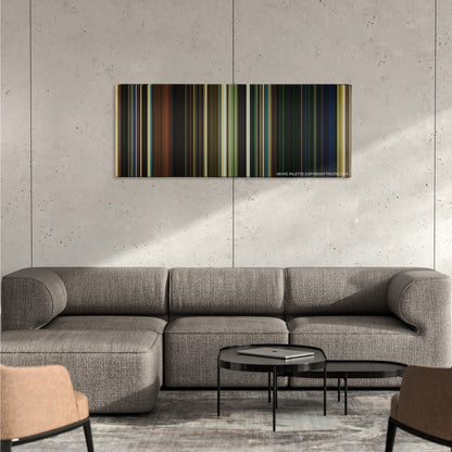 It Chapter Two color palette canvas on a concrete wall above a gray sectional sofa