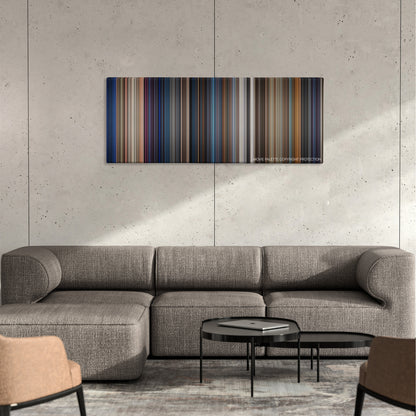 The Last Boy Scout color palette canvas on a concrete wall above a gray sectional sofa