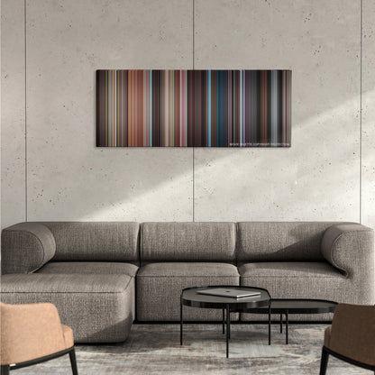 It Follows color palette canvas on a concrete wall above a gray sectional sofa