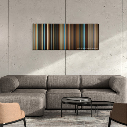 Reign Over Me color palette canvas on a concrete wall above a gray sectional sofa