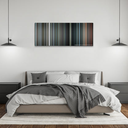 Inside Man color palette canvas above a bed, between two black pendant lamps