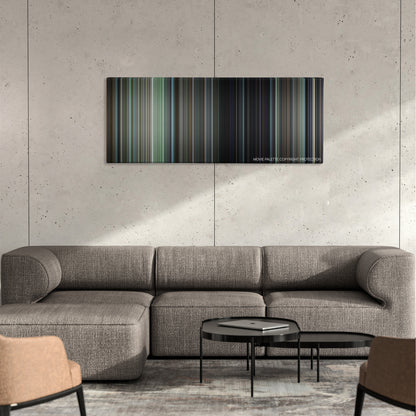 Patriots Day color palette canvas on a concrete wall above a gray sectional sofa